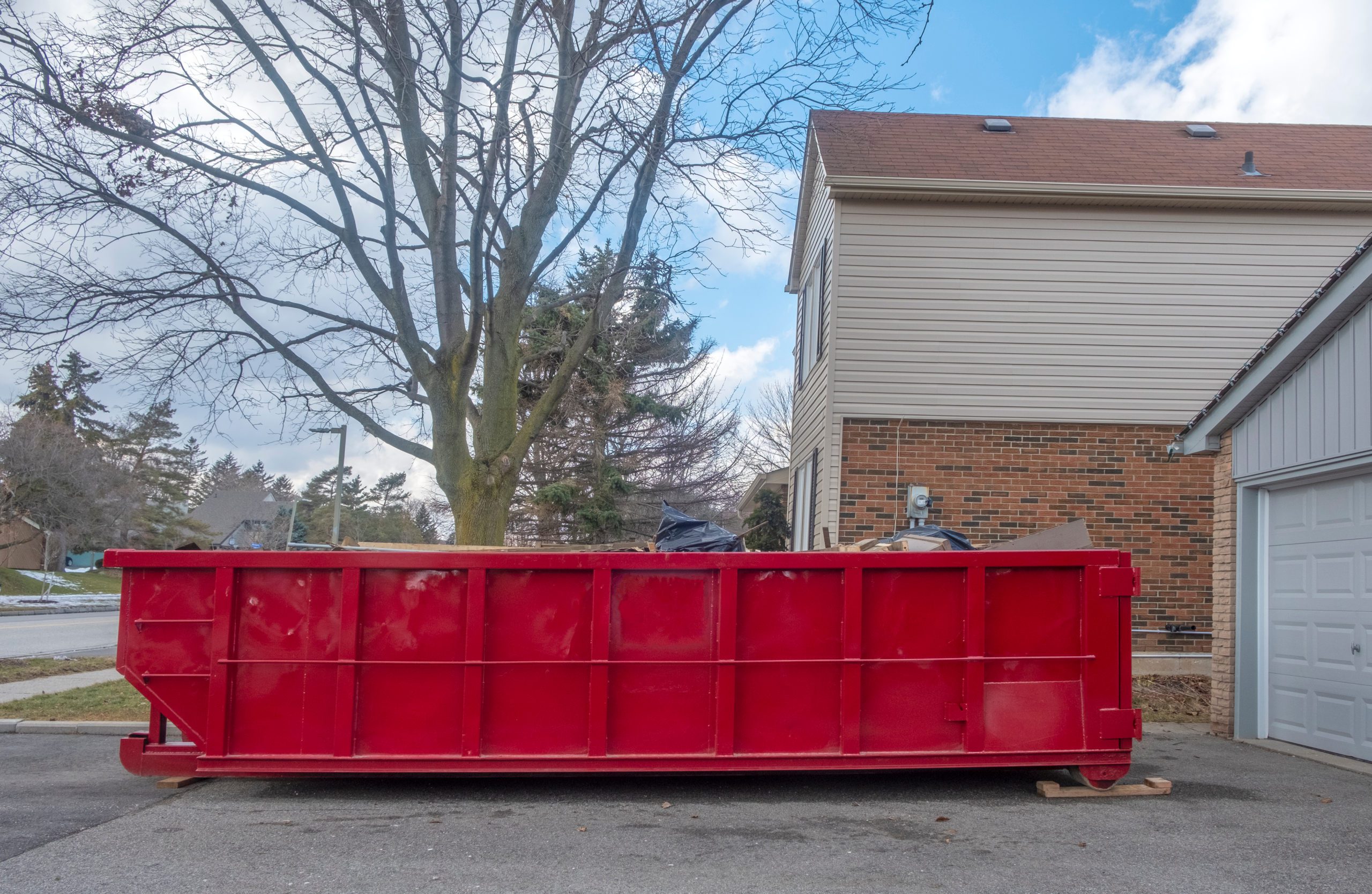 red, roll-off dumpster